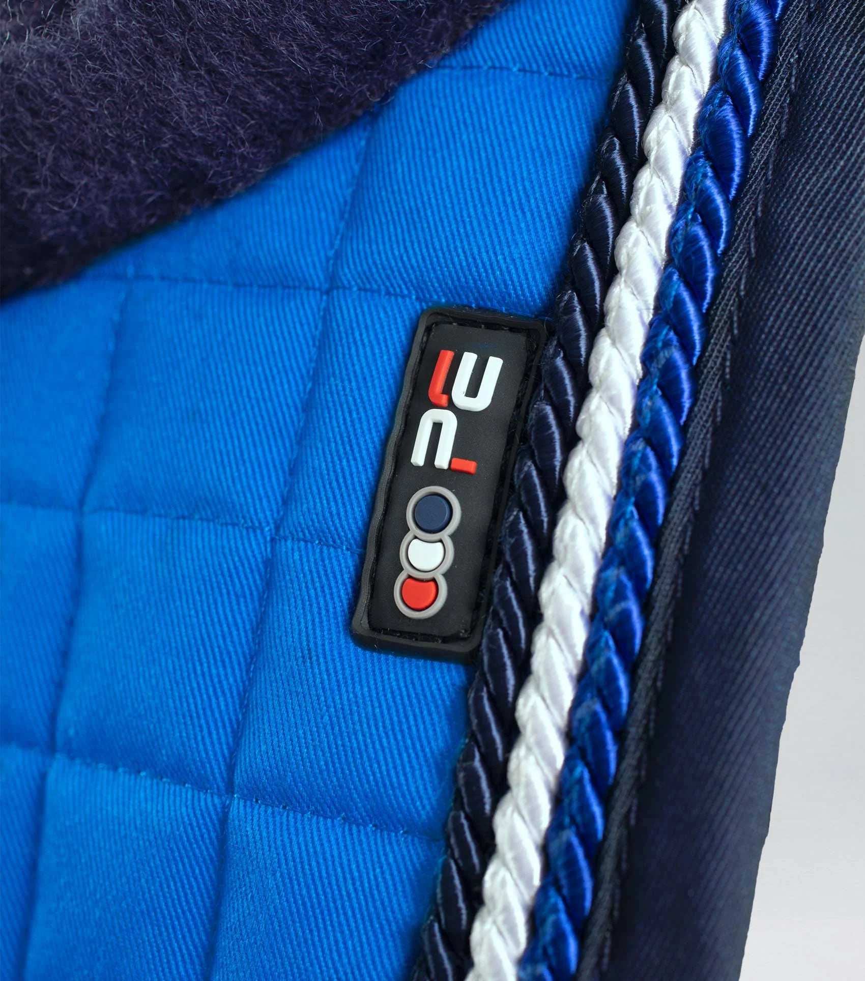 Premier Equine Pony Royal Blue Merino Wool GP Jump Saddle Pad Square Close Up. Quality equestrian equipment for your pony.