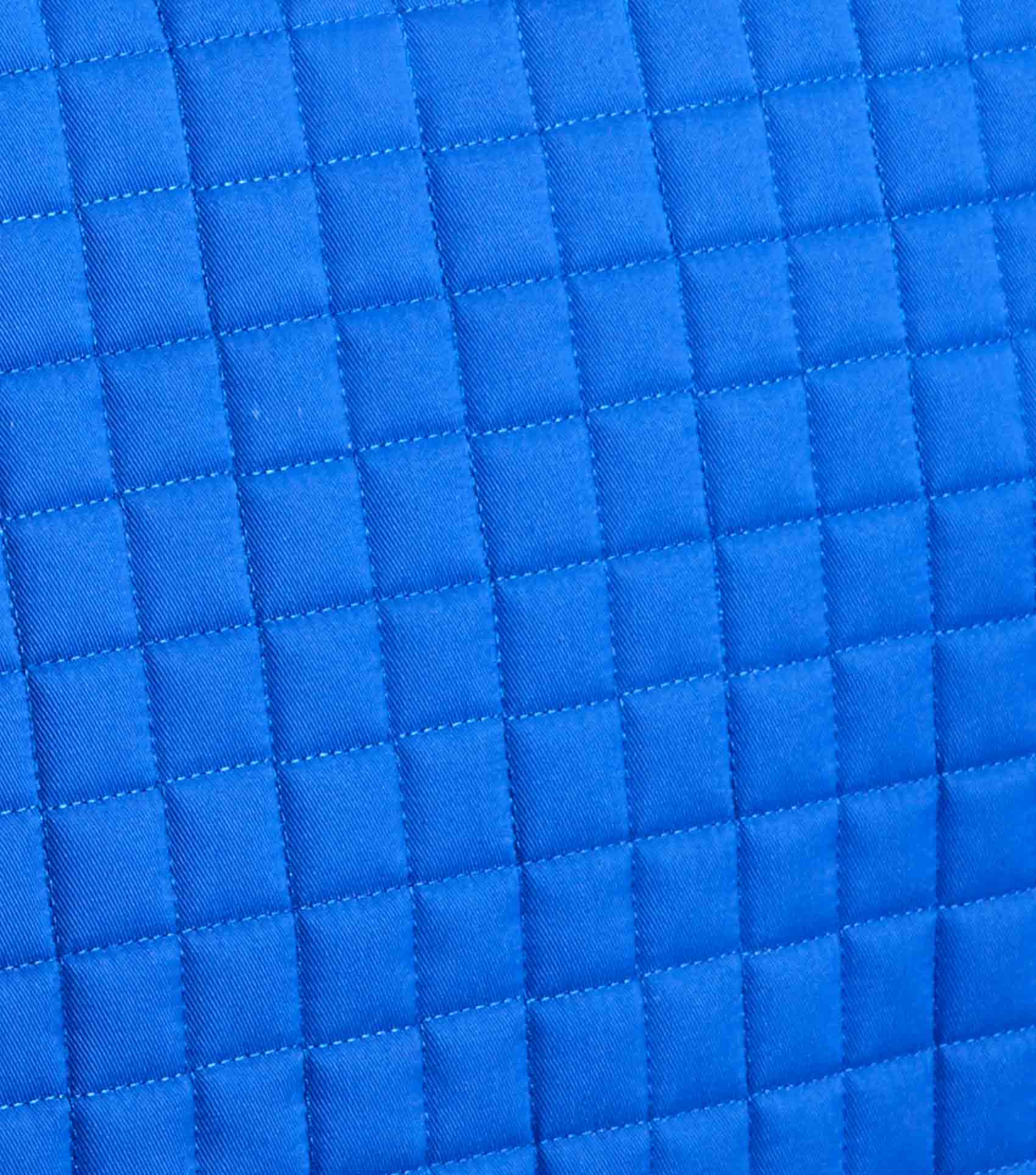 Blue Quilted Saddle Pad: Close-up of Pony Equestrian Pad with Merino Wool Lining for Comfort & Performance. #EquineGear #SaddlePad