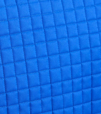 Blue Quilted Saddle Pad: Close-up of Pony Equestrian Pad with Merino Wool Lining for Comfort & Performance. #EquineGear #SaddlePad
