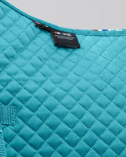 Premier Equine Turquoise Cotton Pony Saddle Pad - Close-up of quilted design and brand label.