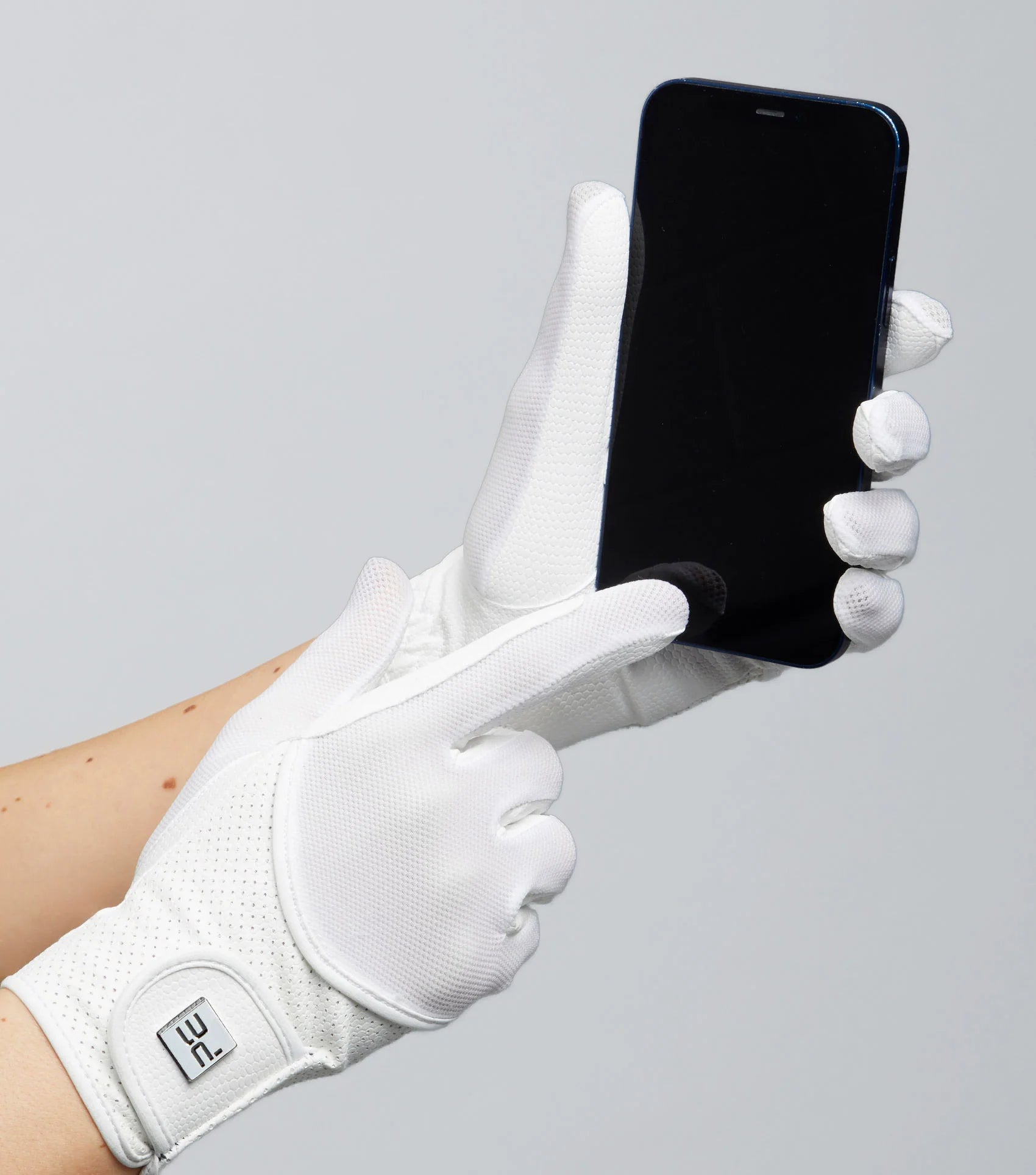 Premier Equine: White Riding Gloves Holding Phone - Mesh Competition Gloves