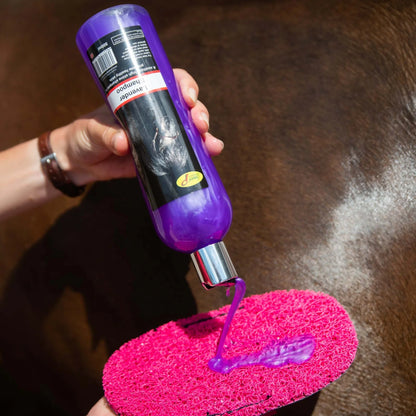 Smart Grooming Lavender Horse Shampoo being poured. Horse grooming product for shiny coat & healthy skin.