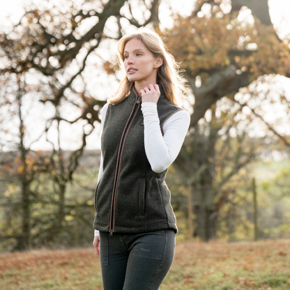 TOGGI Regent womens fleece gilet, country style zip-through with melange effect, worn by a woman outdoors.