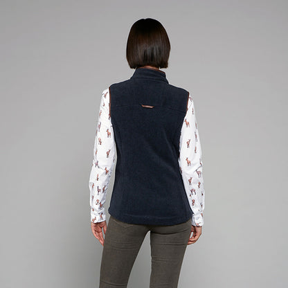 TOGGI REGENT WOMENS FLEECE GILET in navy, worn over a deer print shirt. Back view.