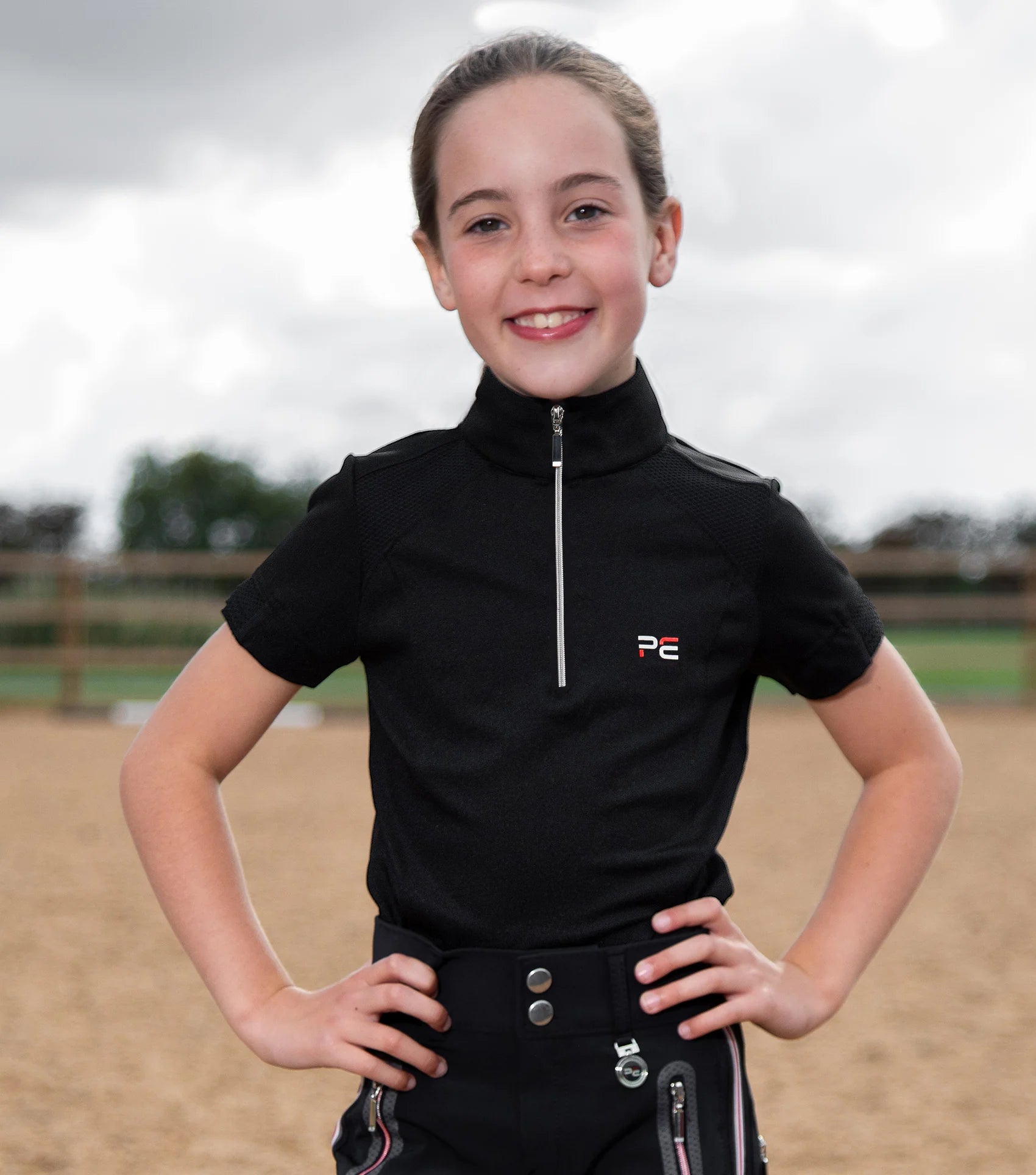 Girl in Black Premier Equine Riding Top - Mini Remisa Technical Short Sleeve Shirt for Equestrian Training