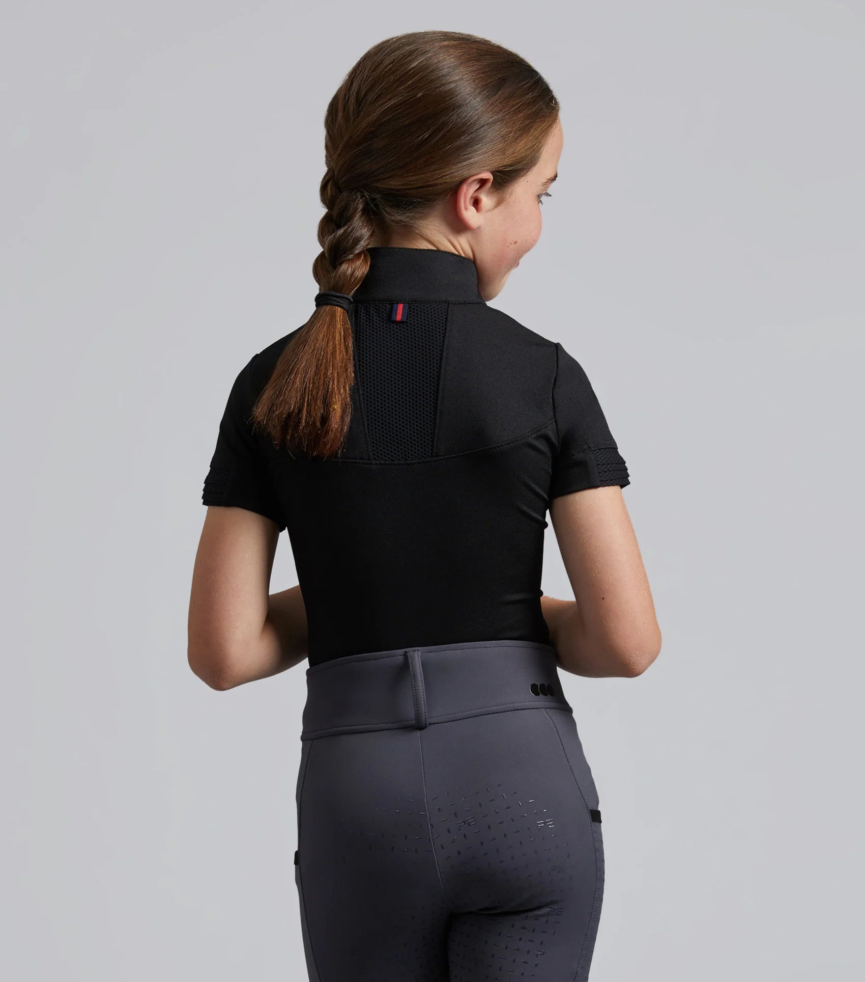 Girl's Black Premier Equine Remisa Riding Top | Technical equestrian shirt from Equiflair for young riders.
