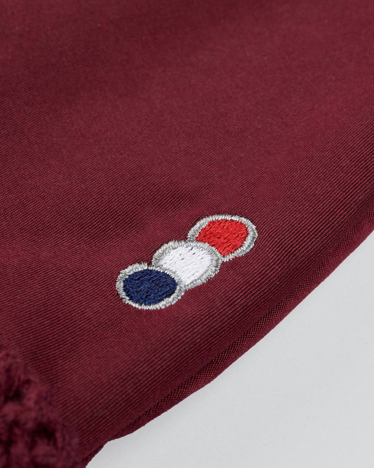 PREMIER EQUINE SALTO FLY VEIL WINE, Stylish equestrian fly veil with red, white, and blue detail.