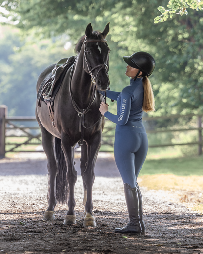 Equestrian with Horse in EQUIDRY Riding Leggings: Water Repellent, Knee Grip, Women's Steel Blue/Grey. Riding Apparel.