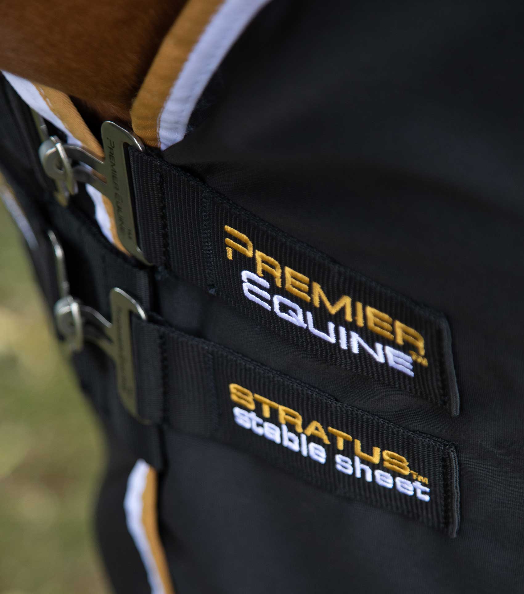 Premier Equine Stratus Stable Sheet Black: Close-up of Straps & Logo. Horse Stable Blanket for Moisture Wicking & Breathability