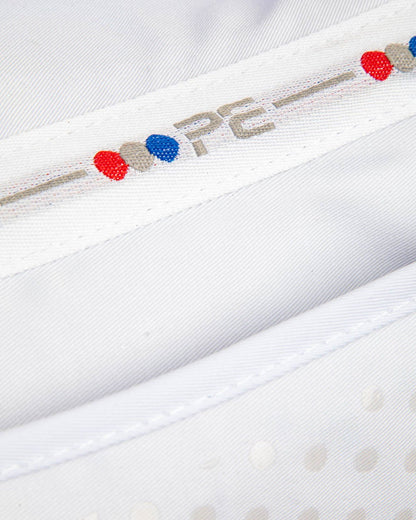 Close-up of a PREMIER EQUINE Tech Grip Pro Anti-Slip Correction Saddle Pad in White, showing detail and logo. Equestrian product image.