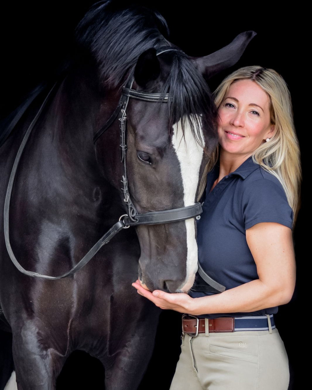Woman & Black Horse with Bitless Bridle. Feeding Equine. THINLINE BITLESS NOSEBAND BRIDLE CONVERTER BLACK by Equiflair - Full