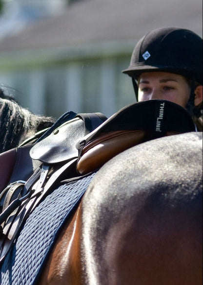 THINLINE Seat Saver Black on Saddle with Rider. Stable Riding and Improved Equitation. - Jump/Close Contact