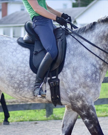 Equestrian: Rider on Horse with Thinline Seat Saver for Comfort & Balance at Equiflair. Improves Seat, Reduces Back Pain.