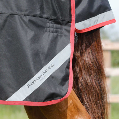 Close-up: Premier Equine Titan 450g Black Turnout Rug. Horse Rug with Reflective Trim & Red Edging. Equiflair.