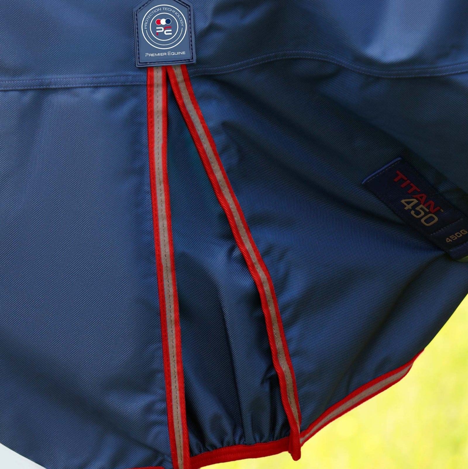 Premier Equine Titan 450g Navy Turnout Rug with Snug-Fit Neck Cover. Heavyweight horse rug for winter protection.