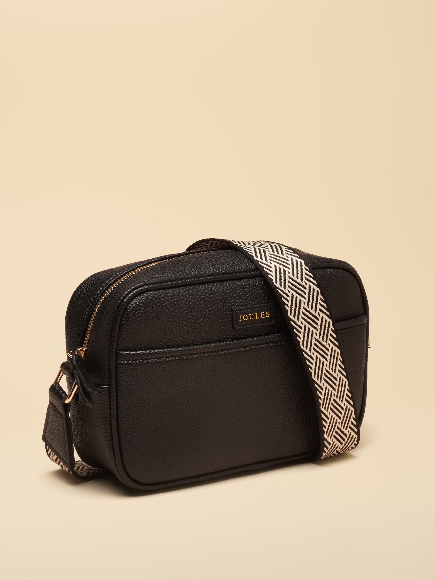 Black faux leather Joules women's crossbody bag with patterned adjustable strap