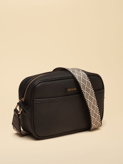 Black faux leather Joules women's crossbody bag with patterned adjustable strap