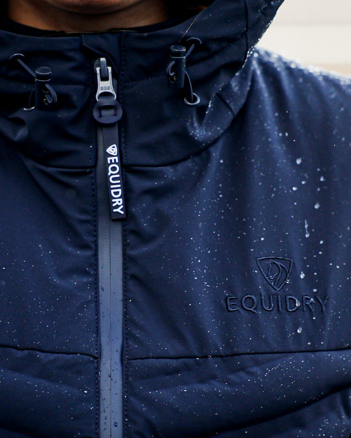EQUIDRY Tamar Women's Navy Lightweight Gilet with water droplets on fabric