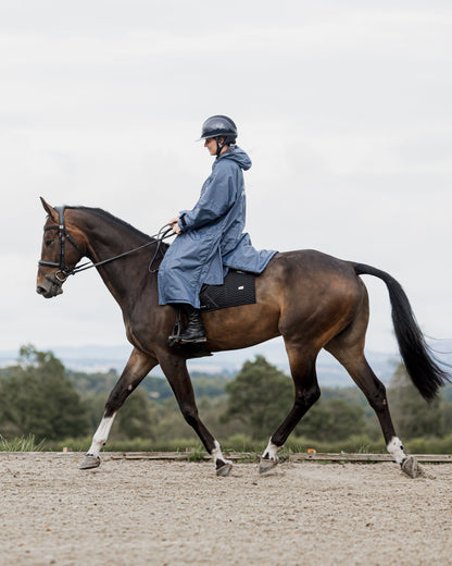 Rider on Horseback in EQUIDRY Evolution Steel Blue Waterproof Coat - Equiflair Equestrian Apparel