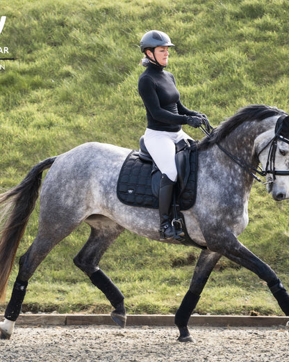 Woman Riding Horse with Woof Wear Vision Dressage Pad - Black - Equiflair