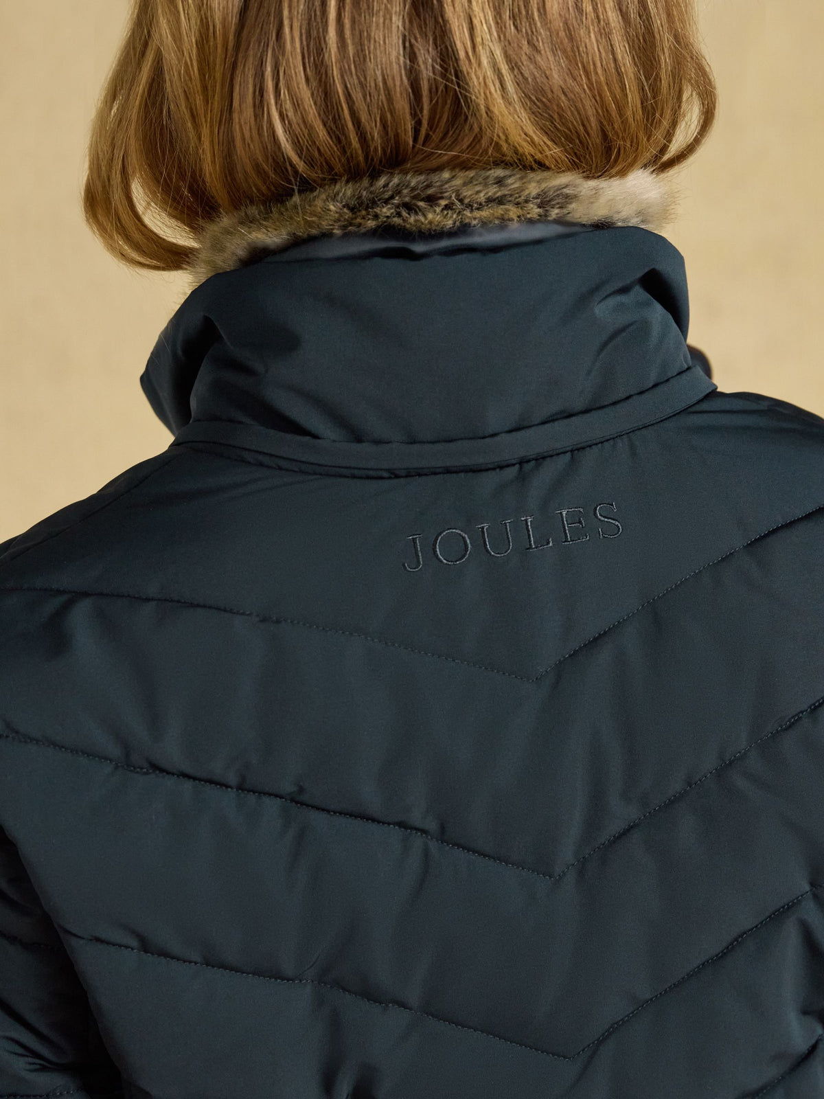 Women's Joules Aspen navy showerproof padded coat with faux fur hood | Stylish & warm outerwear