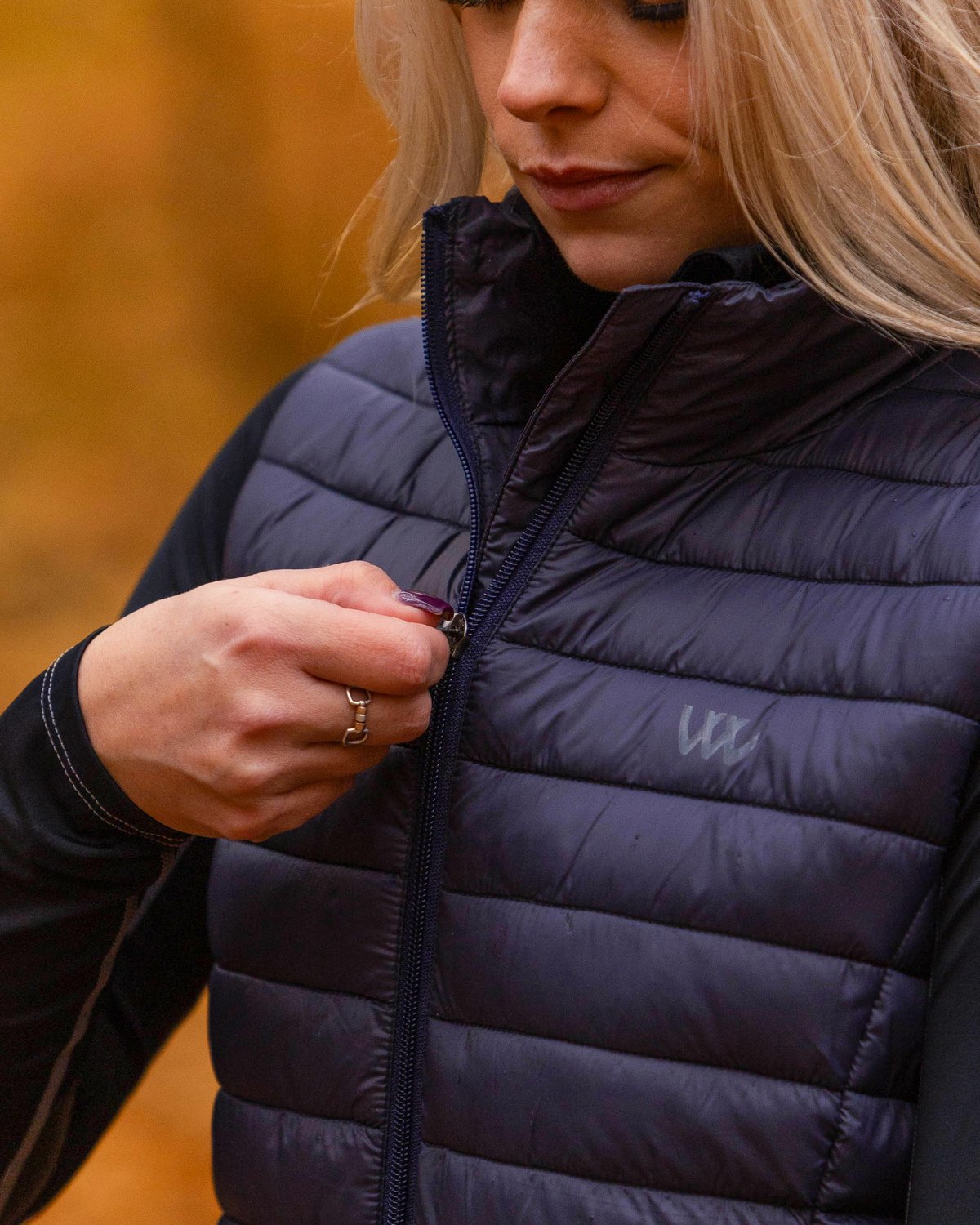 Woman Zipping Woof Wear Heated Gilet Navy Blue | Equestrian Vest | Equiflair Store
