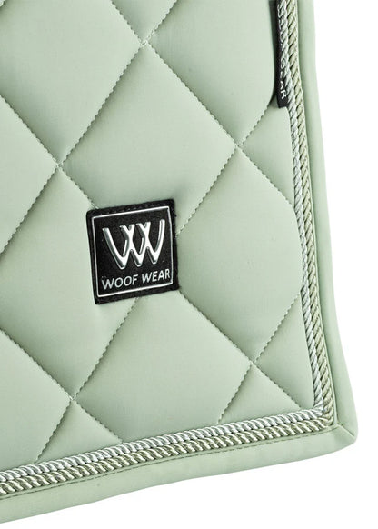 WOOF WEAR Aura Dressage Saddle Pad - Sage Green Horse Riding Equestrian - Close Up of Quilting and Logo