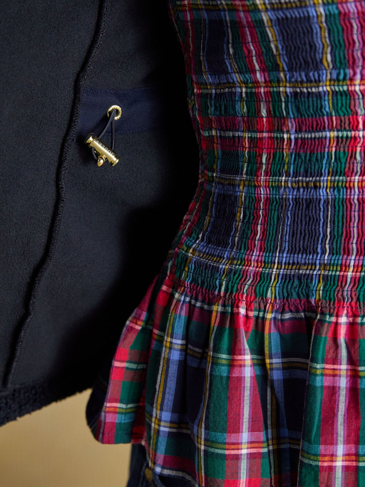 Joules women's navy borg fleece jacket with plaid smocked bodice and gold hardware detail