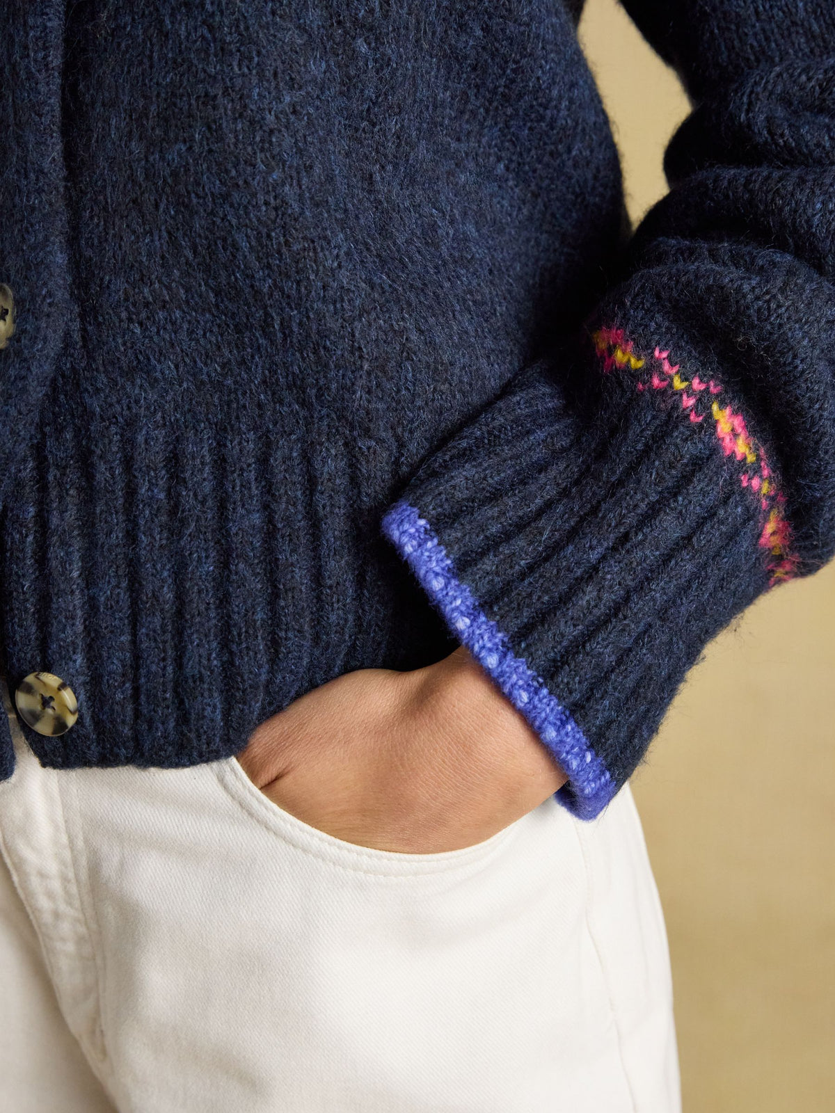 Joules women's navy wool blend Fair Isle knitted cardigan with patterned cuff and hand in pocket.
