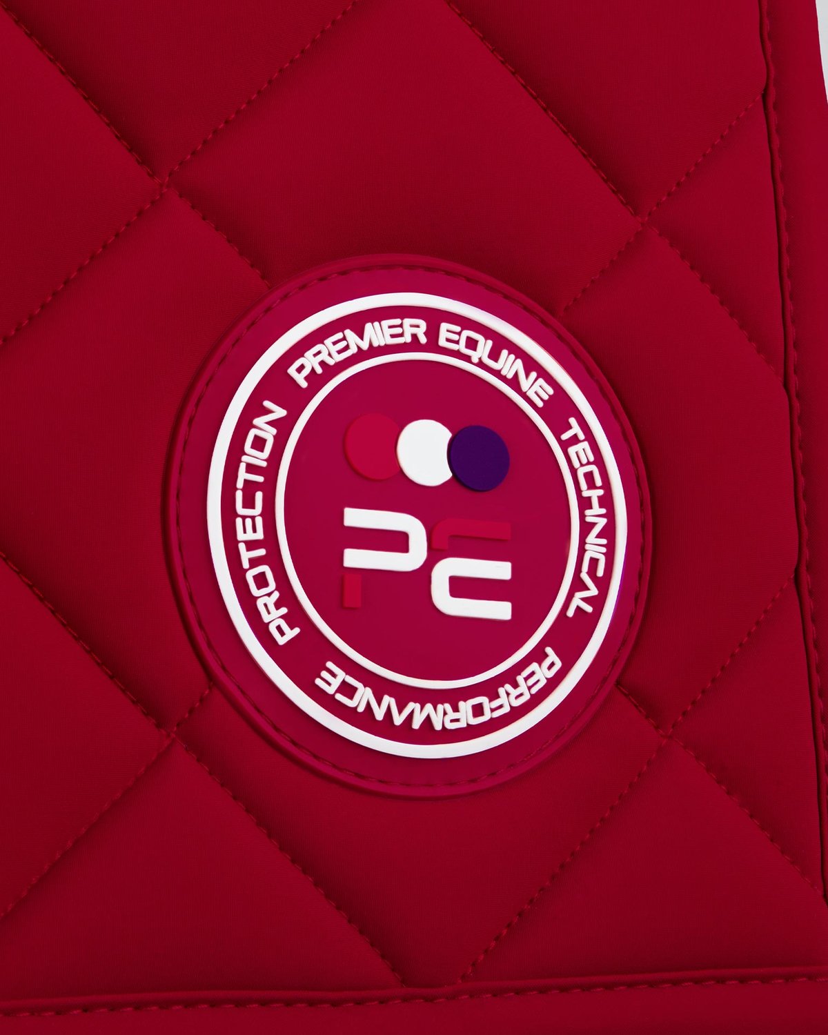 PREMIER EQUINE ATLAS Close Contact Dressage Square RED saddle pad detail - Quilted horse tack for performance, protection.
