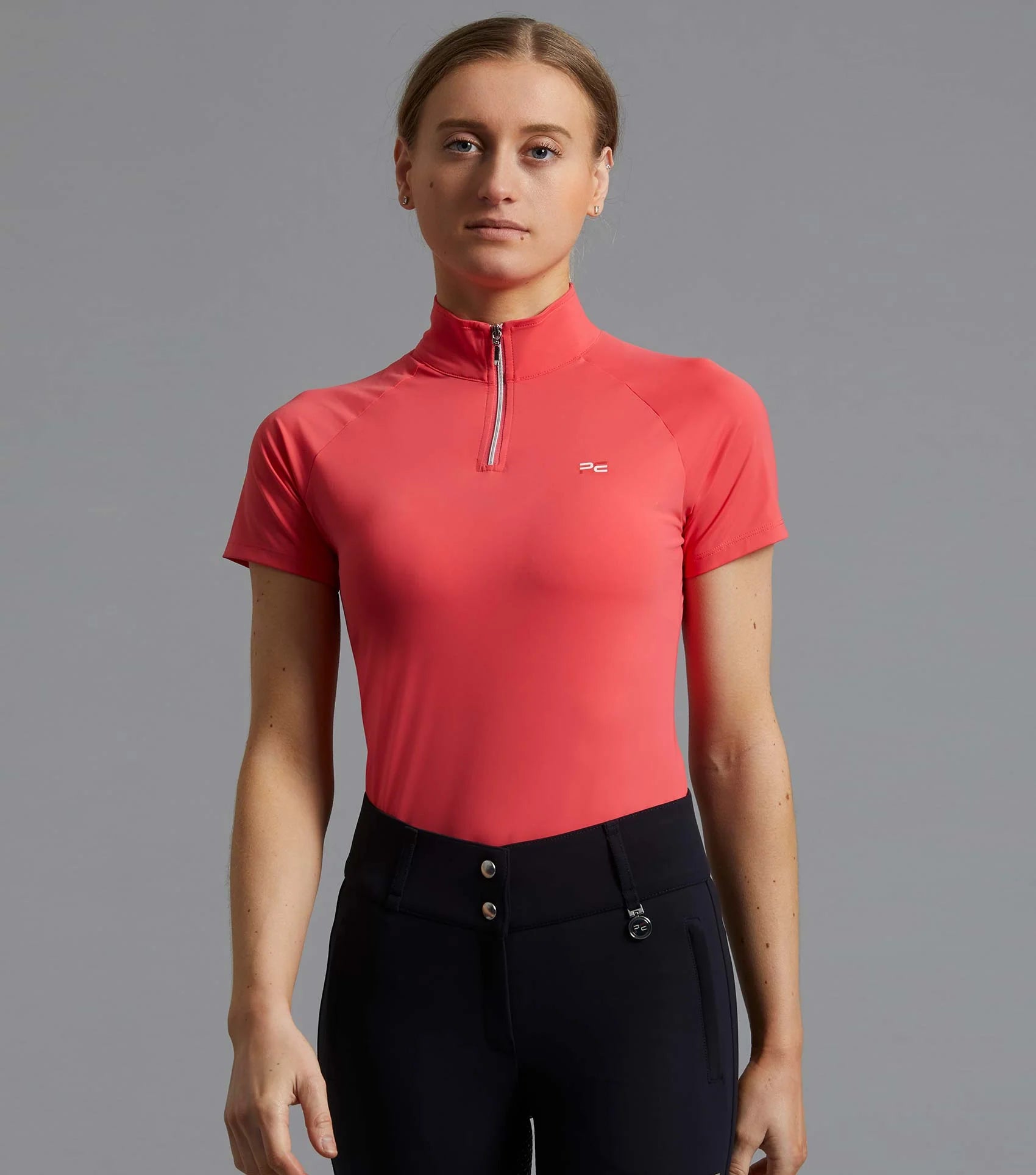 PREMIER EQUINE AURA Ladies Riding Top Pink. Breathable short sleeve shirt with zip closure for women riders.