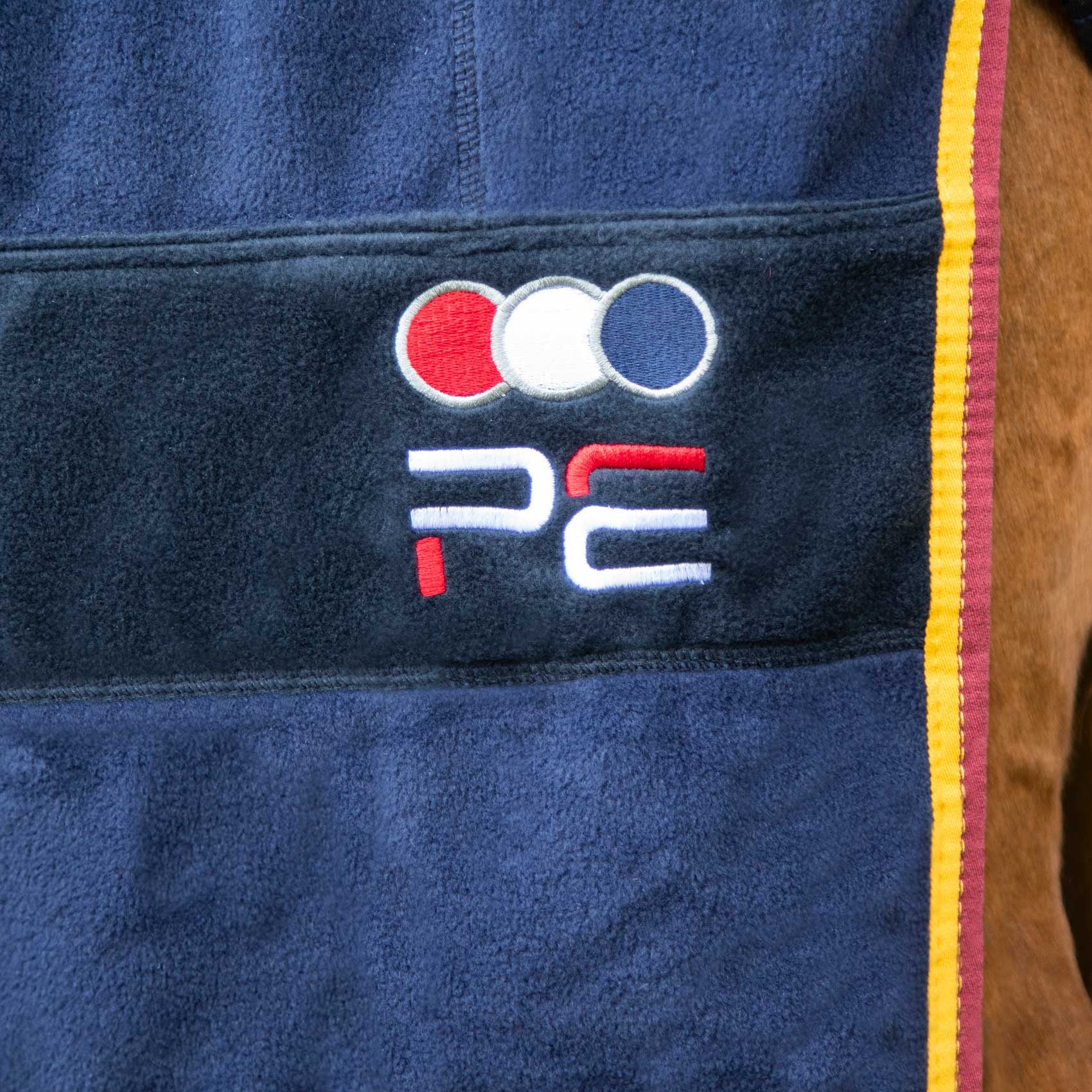 Premier Equine Continental Edition Fleece Cooler Rug - Navy horse rug with color trim. Stylish & functional cooler for horses.