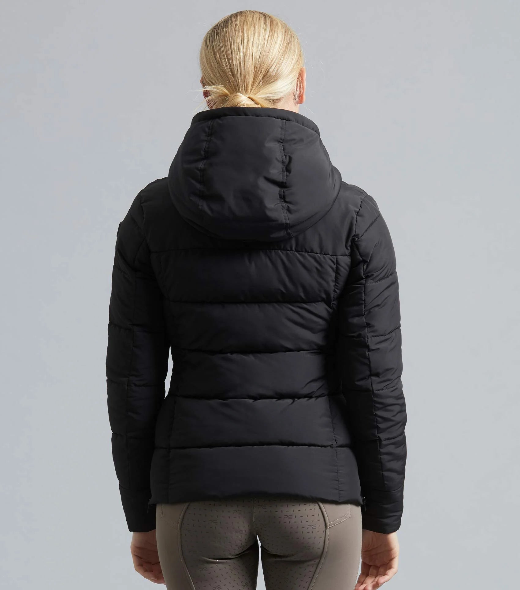 Premier Equine Casella Ladies Quilted Jacket Black - Back View. Puffer Style Riding Jacket with Hood and Water Resistant Zips.