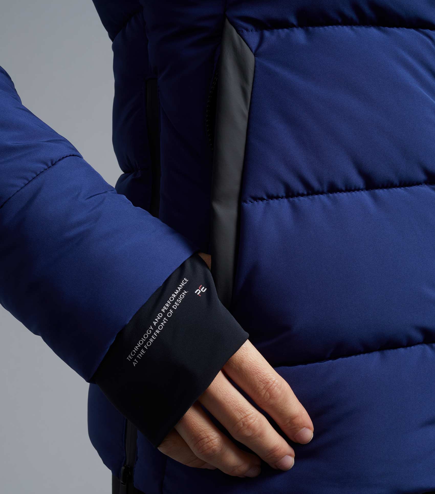 PREMIER EQUINE CASELLA LADIES QUILTED JACKET IMPERIAL NAVY: Luxurious, water-resistant riding jacket with storm cuffs for wind-chill protection.