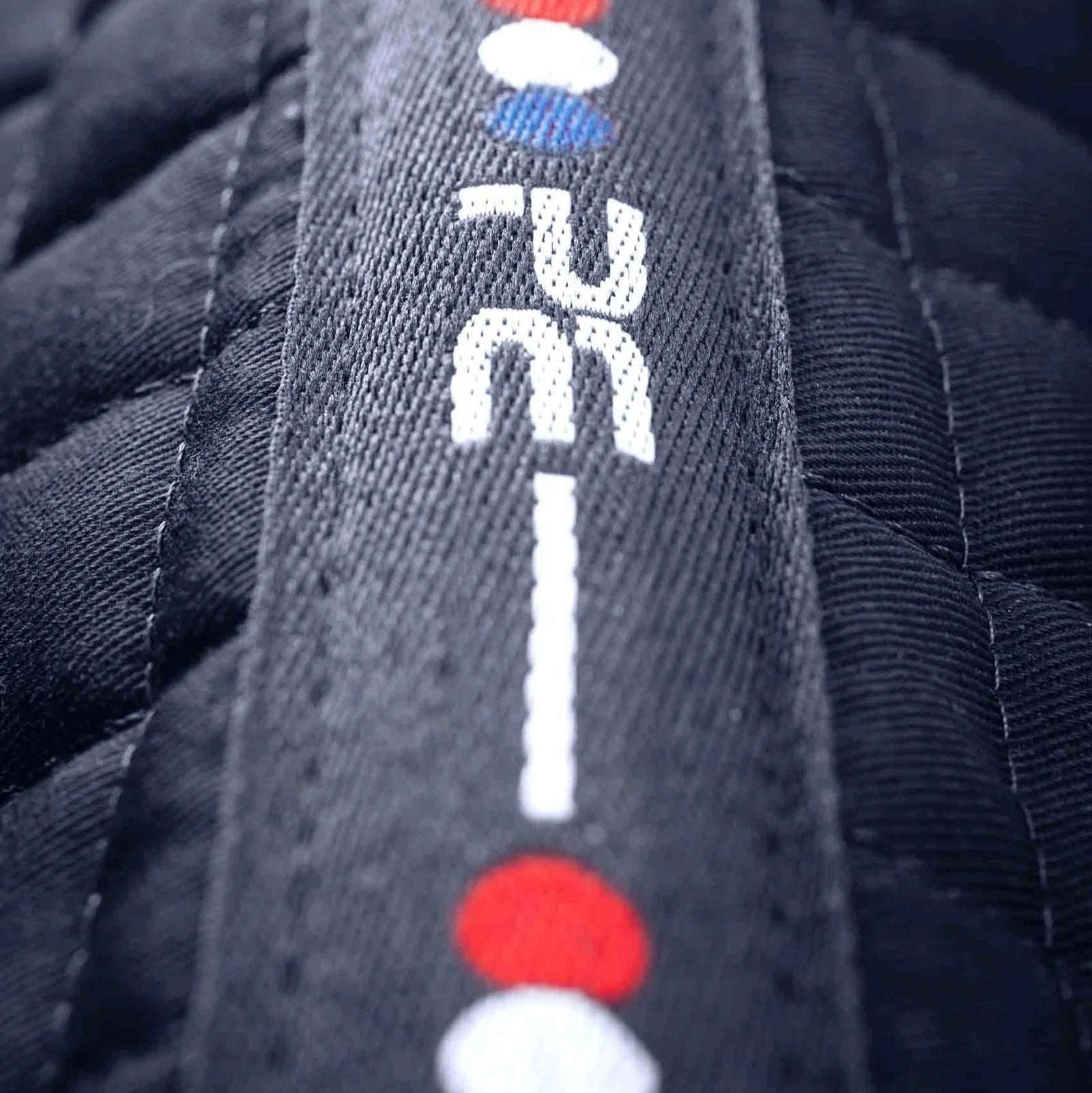 Close Contact Cotton Dressage Saddle Pad - Premier Equine Navy Blue. Quilted equestrian equipment detail.