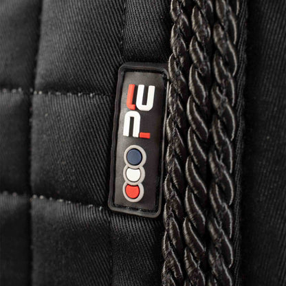 PREMIER EQUINE Close Contact Saddle Pad - Black GP/Jump Square. Twisted rope detail, brand logo close-up.