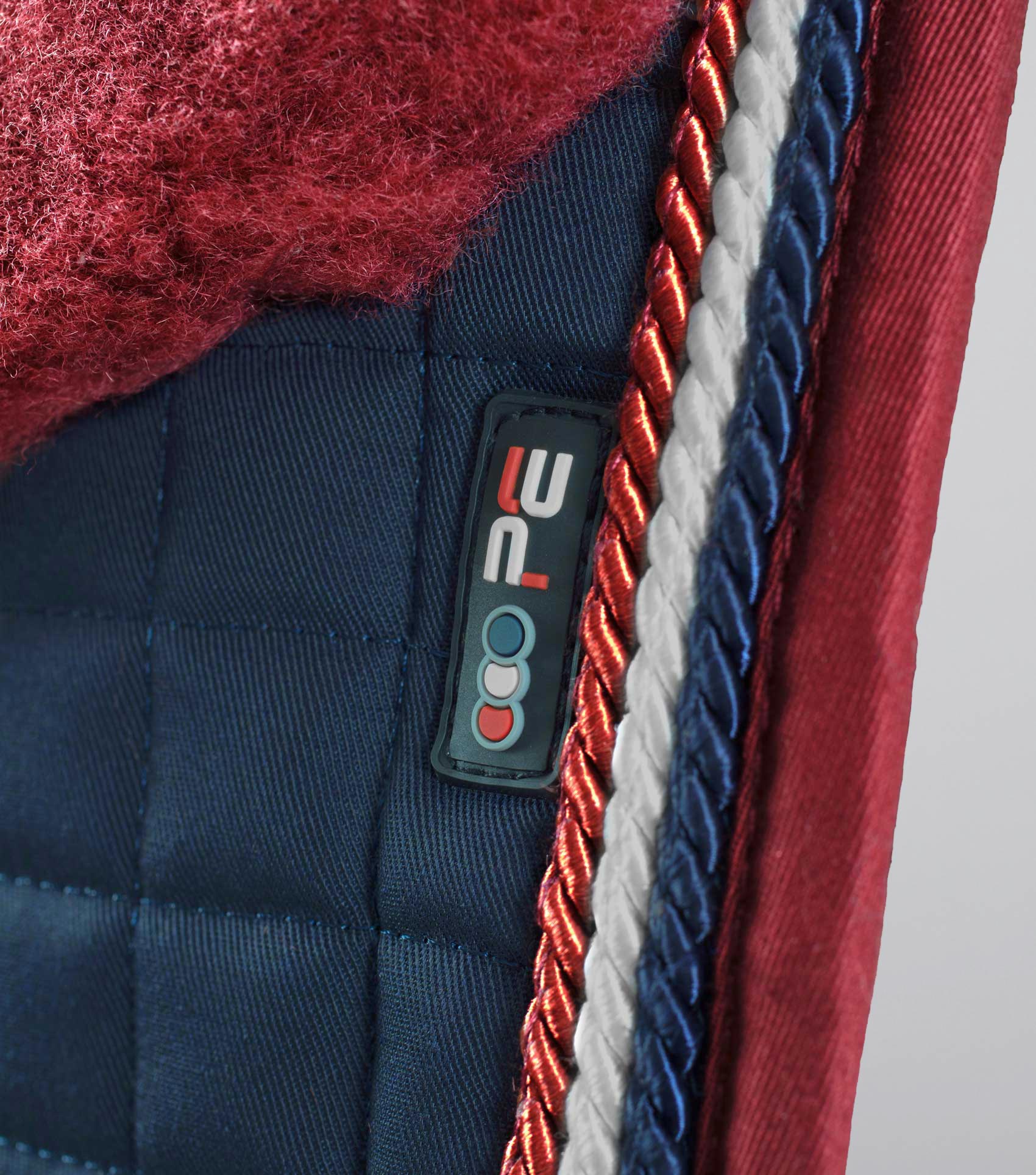 PREMIER EQUINE Merino Wool Dressage Square Saddle Pad - Navy/Burgundy Wool, Horse Riding Equipment Close-Up