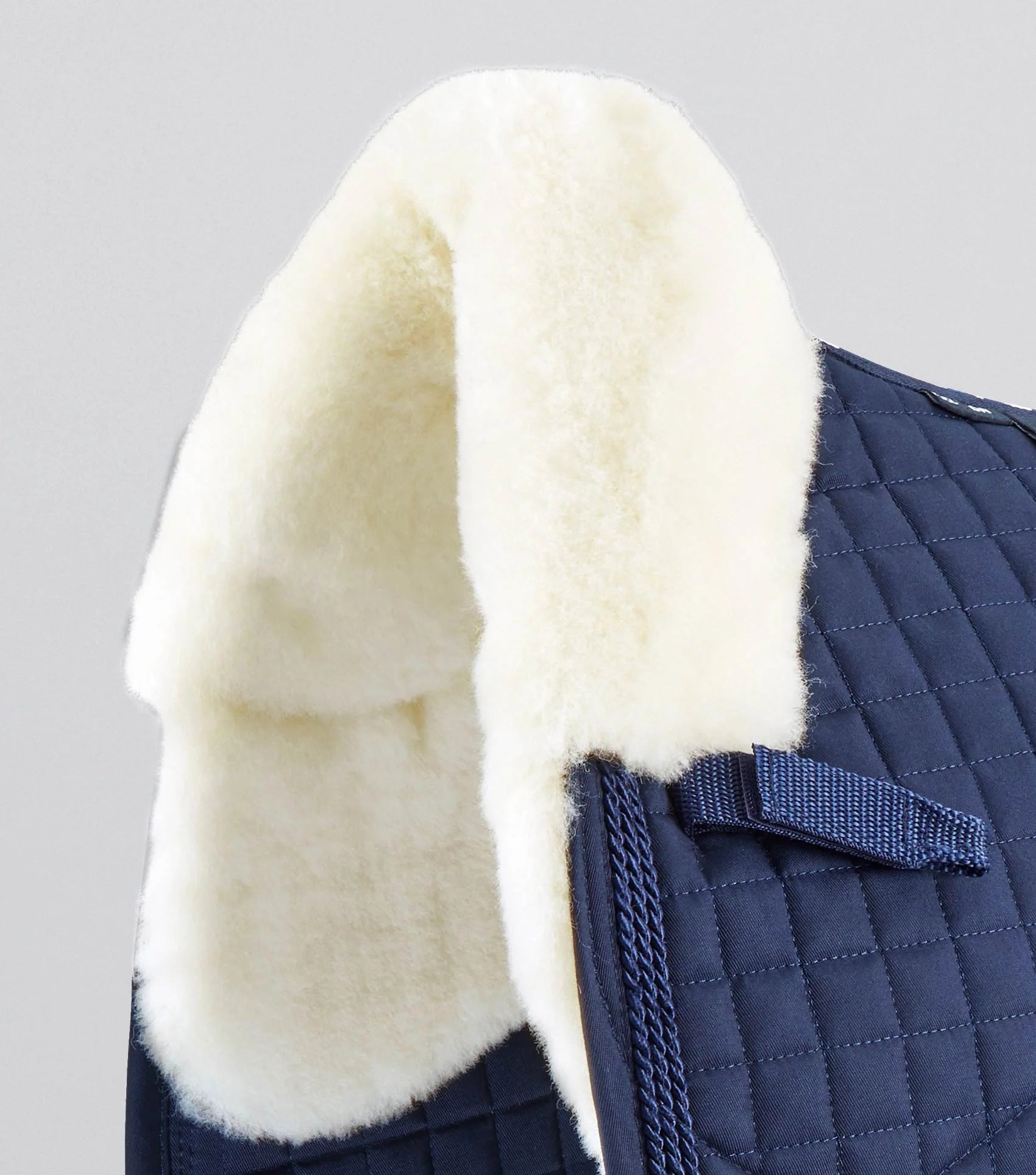 Premier Equine Merino Wool Dressage Saddle Pad - Navy/Natural Wool Close-Up. Premium Equestrian Gear.