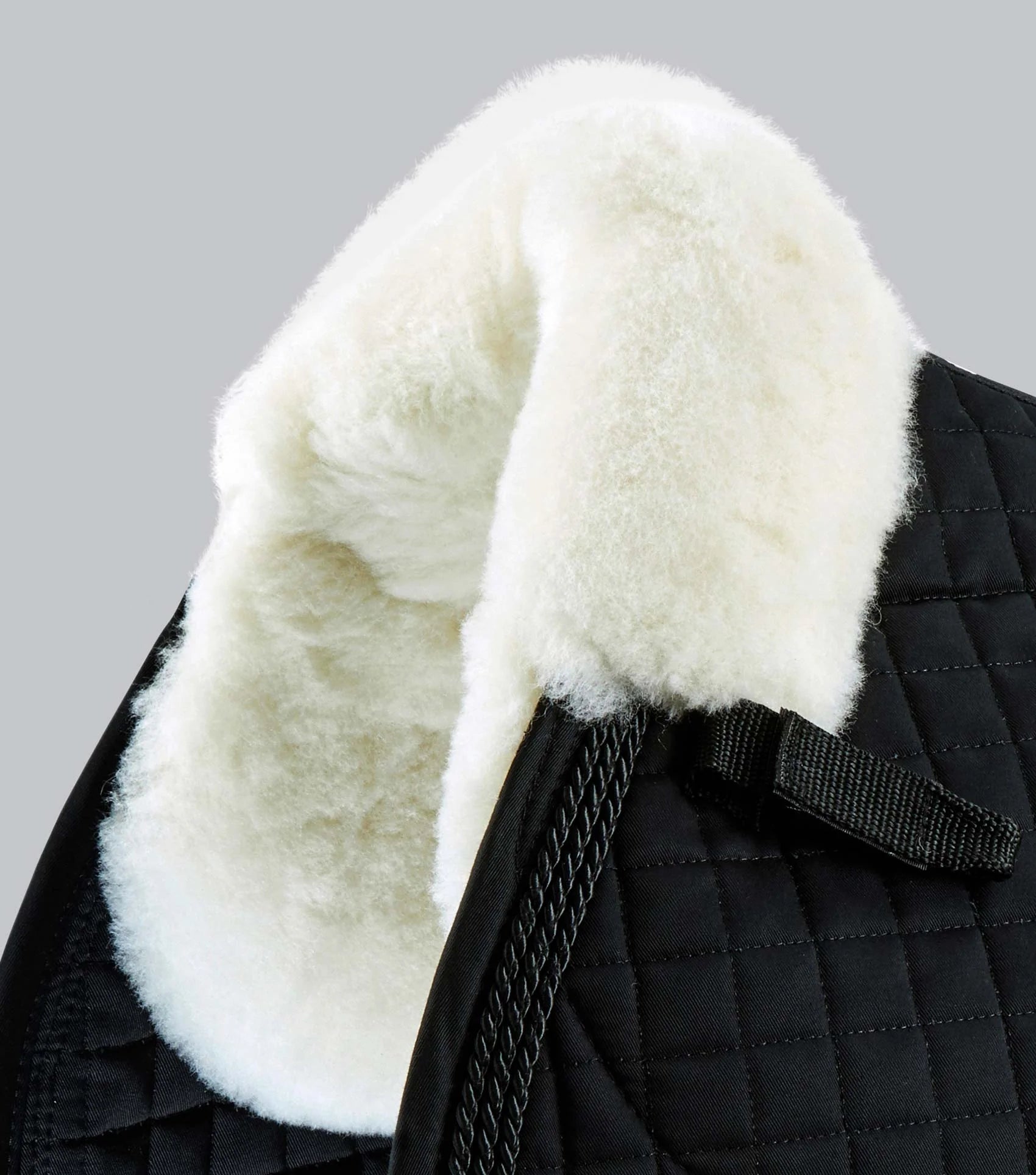Black Premier Equine Merino Wool Saddle Pad - GP/Jump Square with Natural Wool Trim. Close contact and comfortable horse riding equipment.