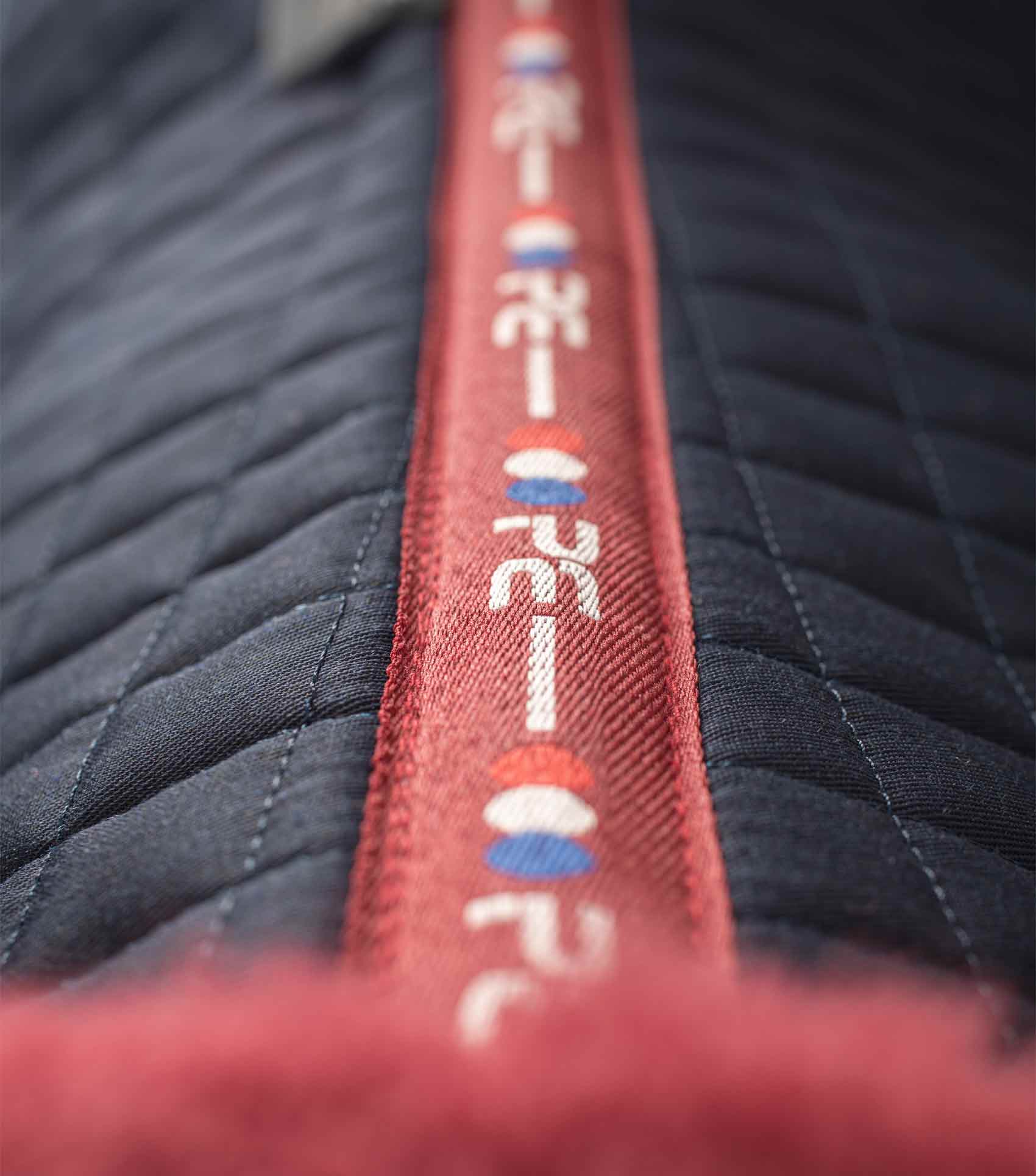 PREMIER EQUINE Merino Wool GP/Jump Saddle Pad - Navy/Burgundy. Close Contact design for equestrian comfort and performance.