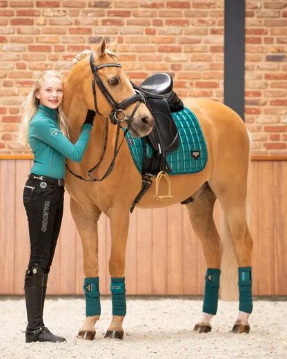 Equestrian Image: Girl Rider & Palomino Horse in Lemieux Loire Polo Bandages - Peacock Equestrian Riding Outfit
