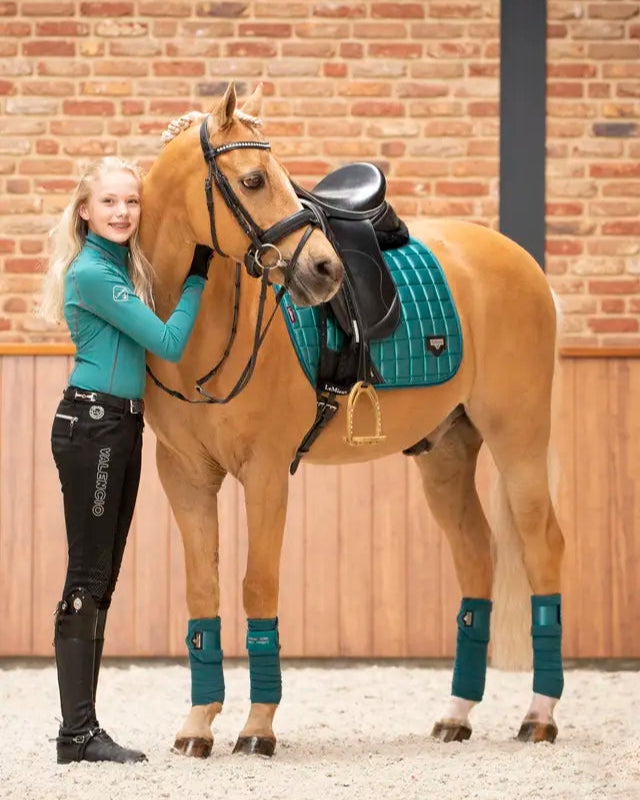Equestrian Image: Girl Rider & Palomino Horse in Lemieux Loire Polo Bandages - Peacock Equestrian Riding Outfit