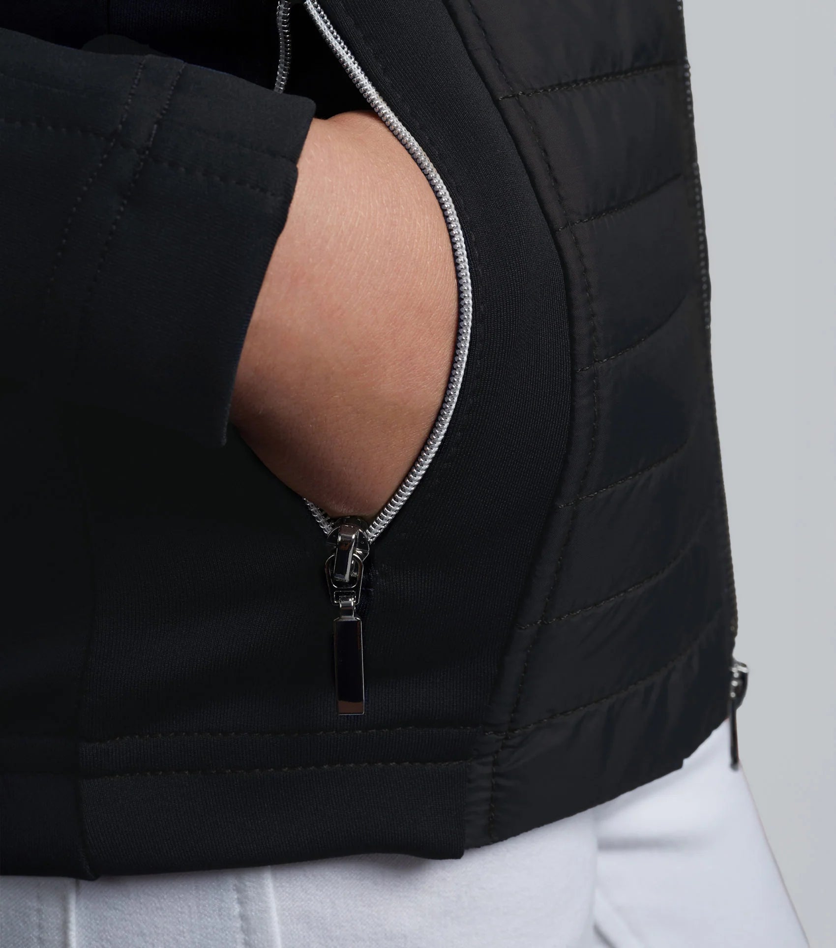 Girl's Black Hybrid Riding Jacket by Premier Equine: Quilted Body, Jersey Sleeves, Zipper Pockets