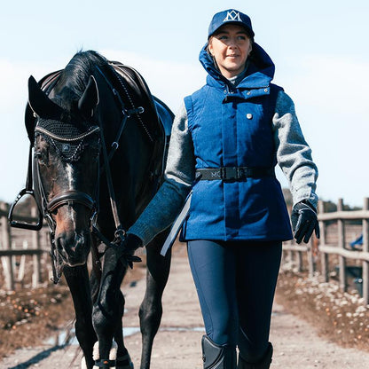 Mountain Horse Felicia Navy Vest: Equestrian woman and horse. Waterproof, stylish riding apparel.
