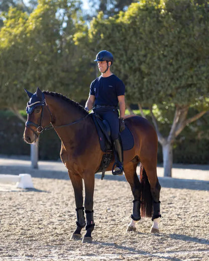 Equestrian: Dressage rider on horse with LeMieux Le Cool Grip saddle pad in navy. #Equiflair #Dressage #Horse