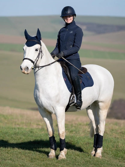 LeMieux Suede GP Square Navy Saddle Pad on Horseback: Equestrian Style & Comfort