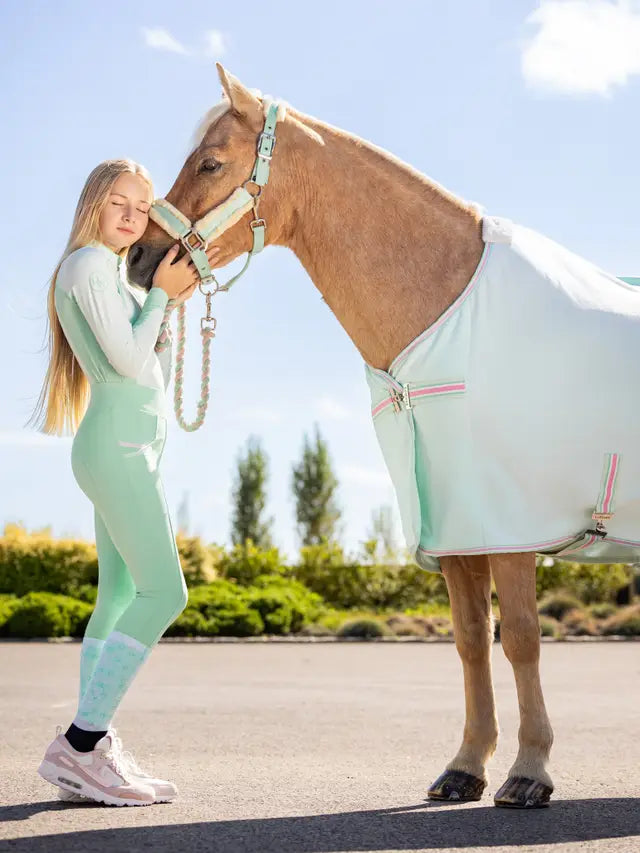 LeMieux Harlow Spearmint Breeches: Girl with Horse in Equestrian Gear. Shop Equiflair for LeMieux Riding Pants!