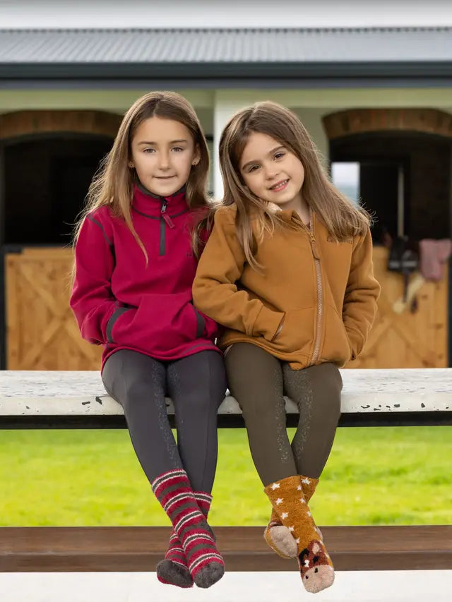 Two Girls in Equestrian Clothing: Lemieux Mini Charlie Lined Hoodie Ginger & Red. Kids' Horse Riding Fashion.
