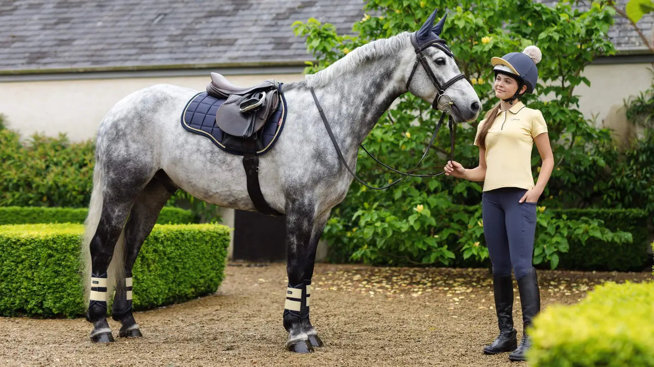 Grey Horse with Rider wearing LEMIEUX Loire Saddle Pad in Dusk Blue for Equestrian Sport