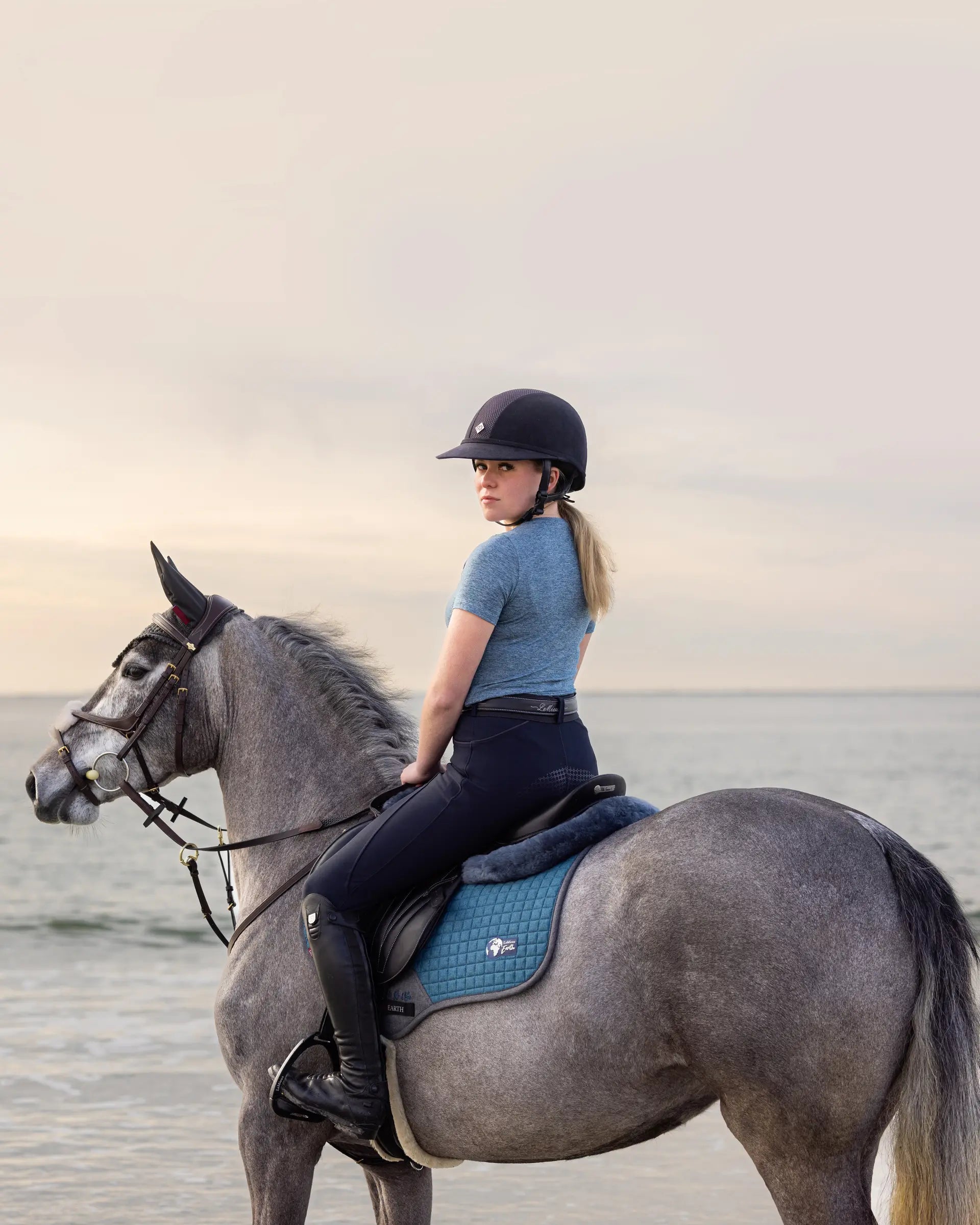 LeMieux Earth GP Square Ocean saddle pad for horse riding, available at Equiflair. Sustainable equestrian gear.